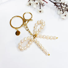 Load image into Gallery viewer, Ameliorate Crystals&#39; Signature: Freshwater Pearls Ribbon Bow Signature Crystal Keychain
