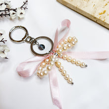 Load image into Gallery viewer, Ameliorate Crystals&#39; Signature: Freshwater Pearls Ribbon Bow Signature Crystal Keychain
