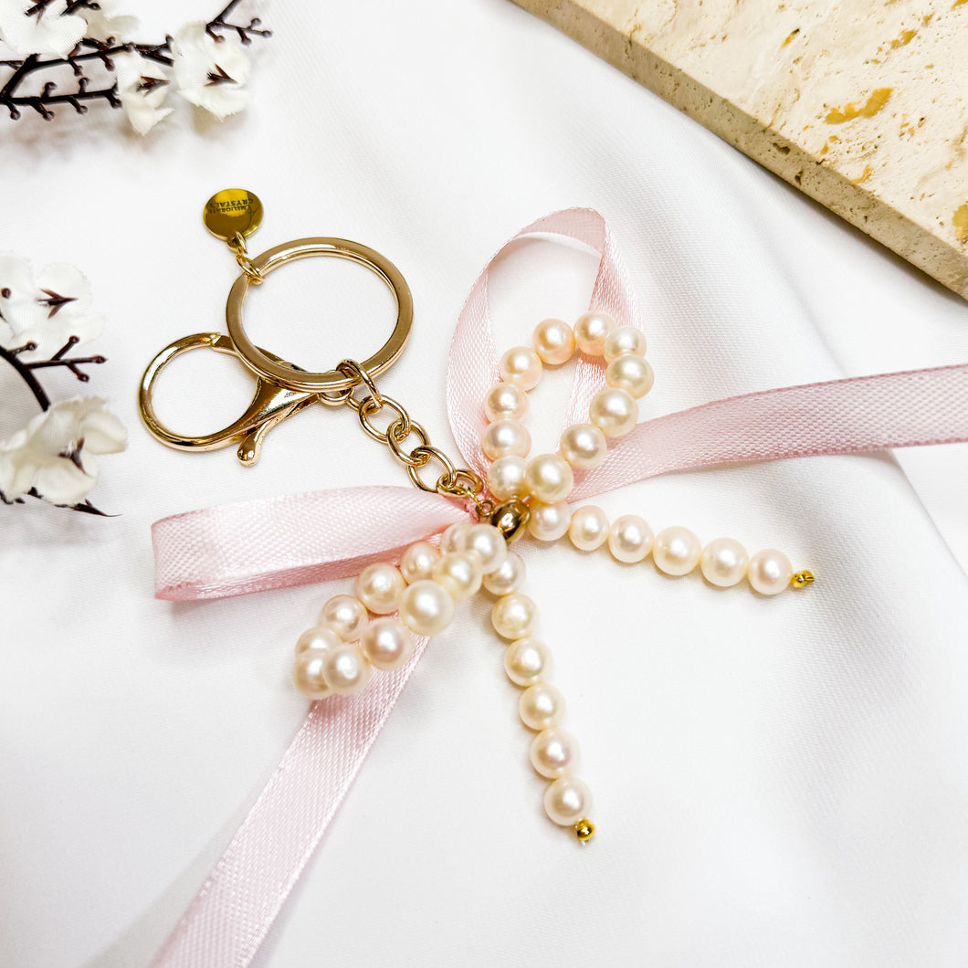 Ameliorate Crystals' Signature: Freshwater Pearls Ribbon Bow Signature Crystal Keychain