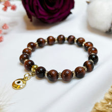 Load image into Gallery viewer, Red Tiger&#39;s Eye Crystal Bracelet (Gold Evil Eye Charm)
